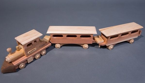 unpainted wooden trains